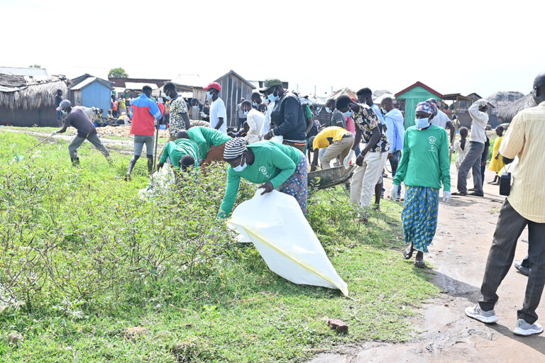 cleaning operations to remove plastic debris and polythene bags from a fishing community on Lake Albert