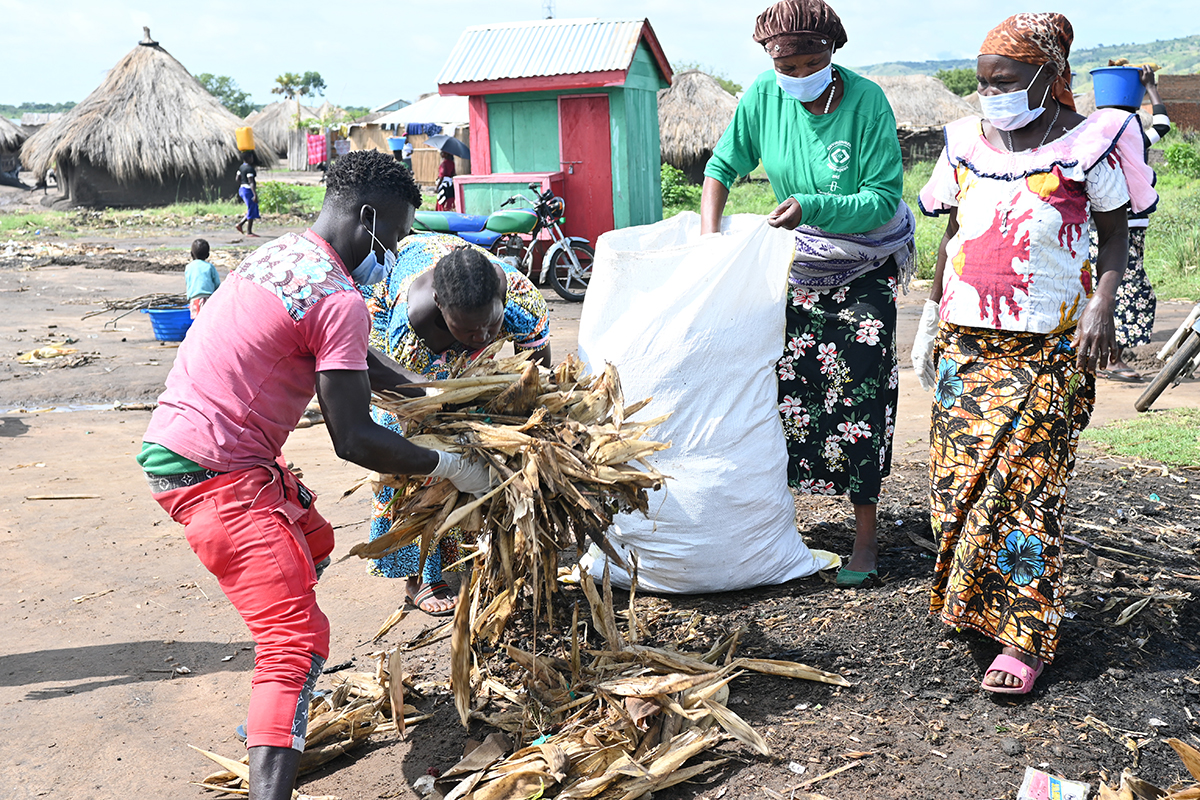 cleaning operations to remove plastic debris and polythene bags from a fishing community on Lake Albert